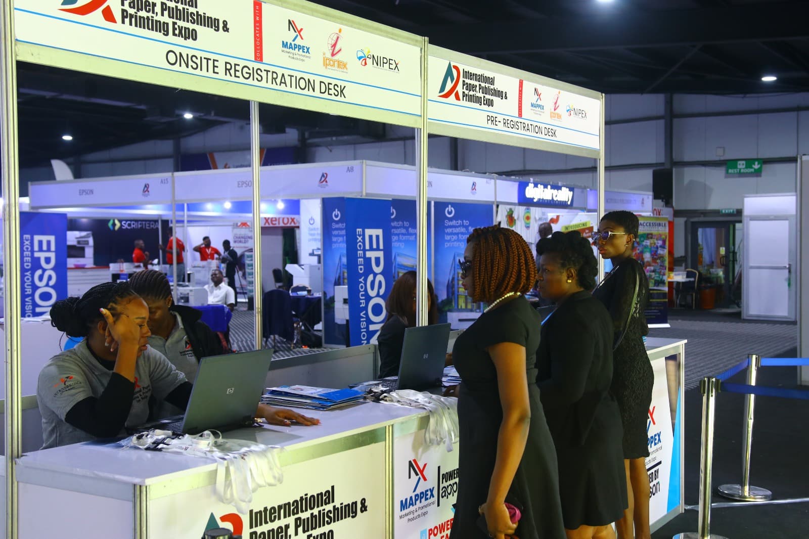 Visitors registering and exploring IPPPEX on the exhibition floor